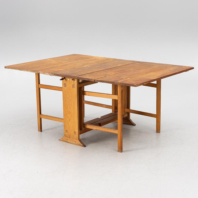 A drop-leaf table, 19th Century.