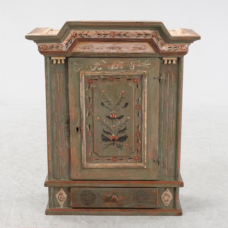 A painted 19th Century wall cabinet.