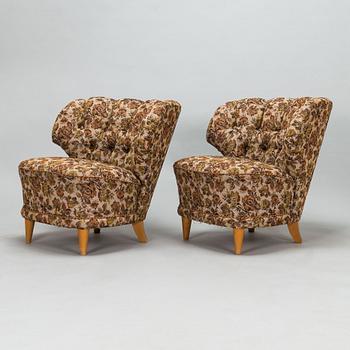 A pair of 1950's armchairs.
