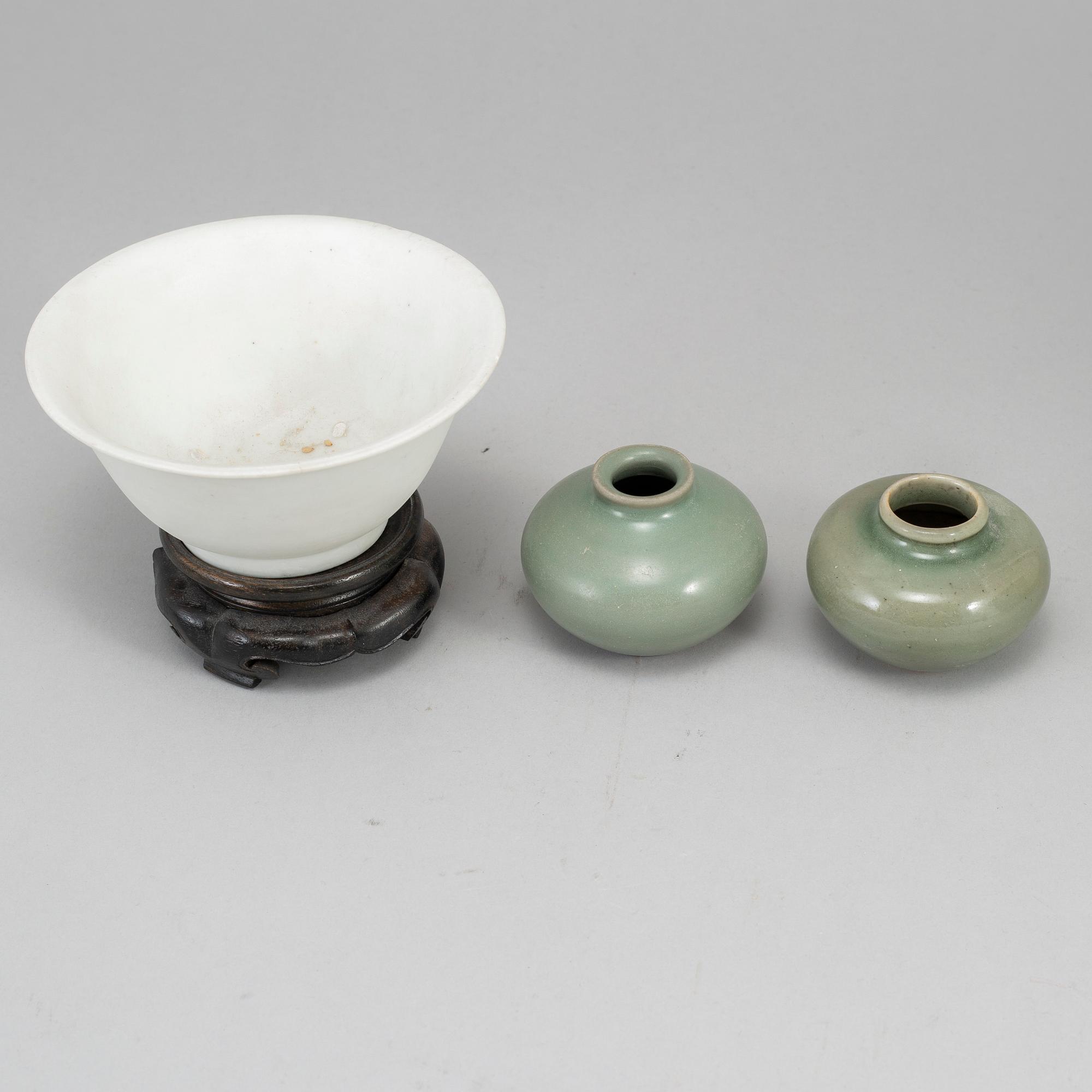 A white glazed bowl and two celadon glazed pots, Mingdynasty and older, shipwreck.