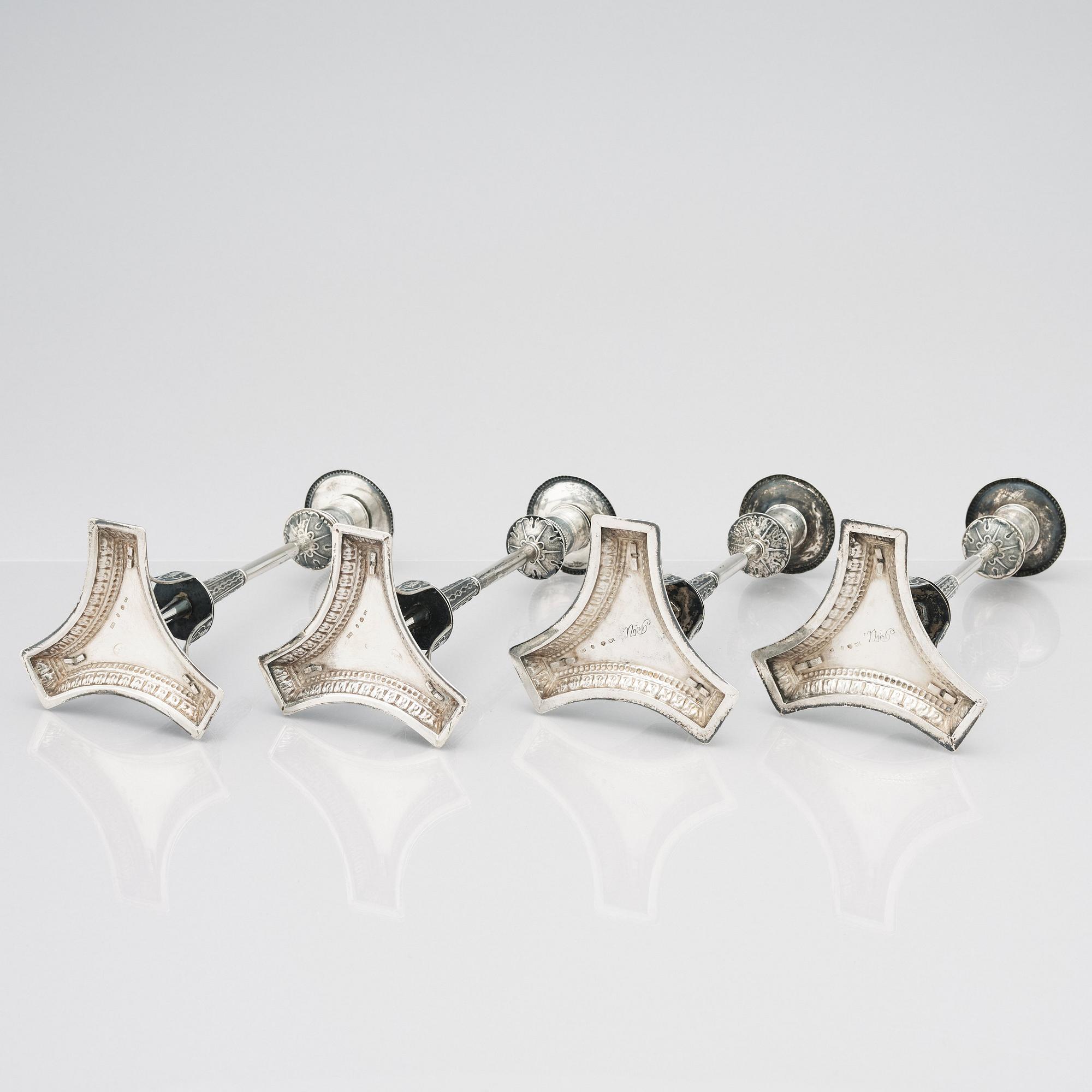 Four Swedish early 19th Century silver candlesticks, mark of Adolf Zethelius, Stockholm 1814 and 1818.