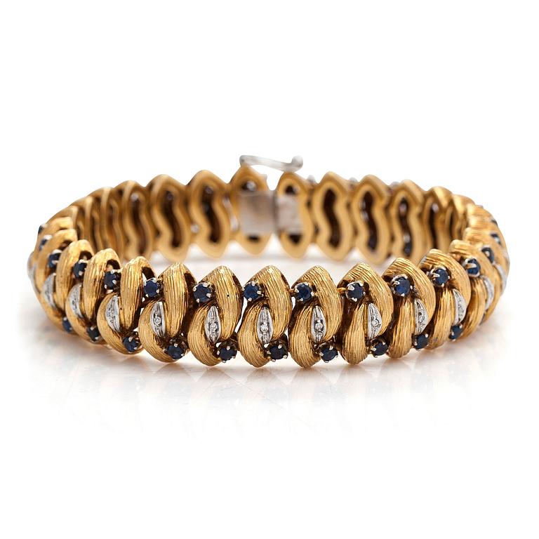 An 18K gold bracelet, diamonds approx. 0.14 ct in total and sapphires, Italy. Finnish import marks.