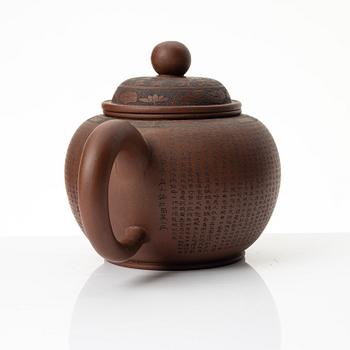 A 'calligraphy' yixing teapot, China, later part of the 1900s.