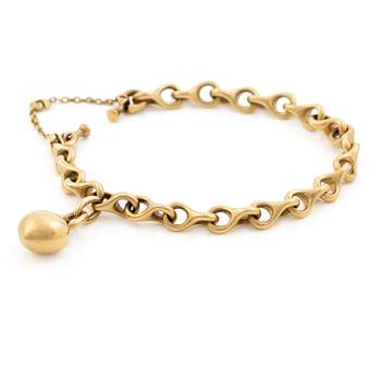 538C. Ole Lynggaard armband 18K guld med hjärtformad berlock.