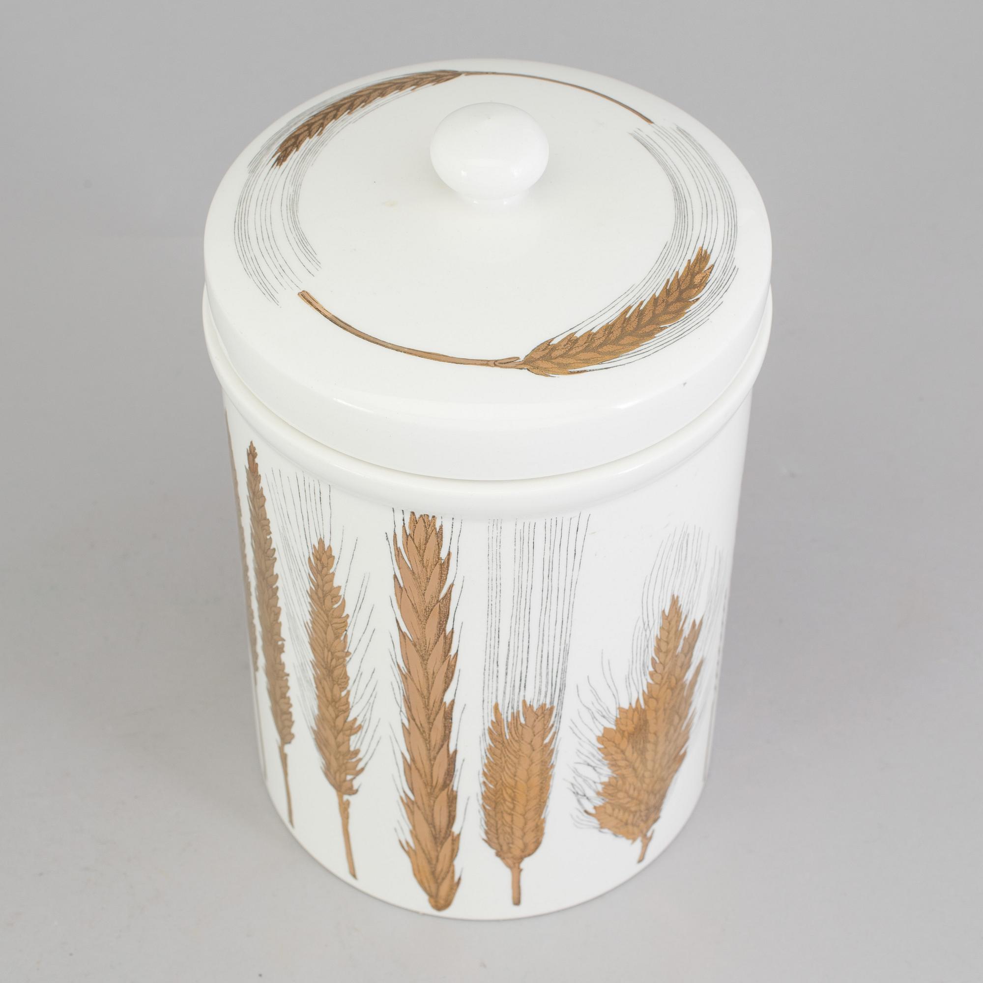 A porcelain jar with lid from Fornasetti, Italy.
