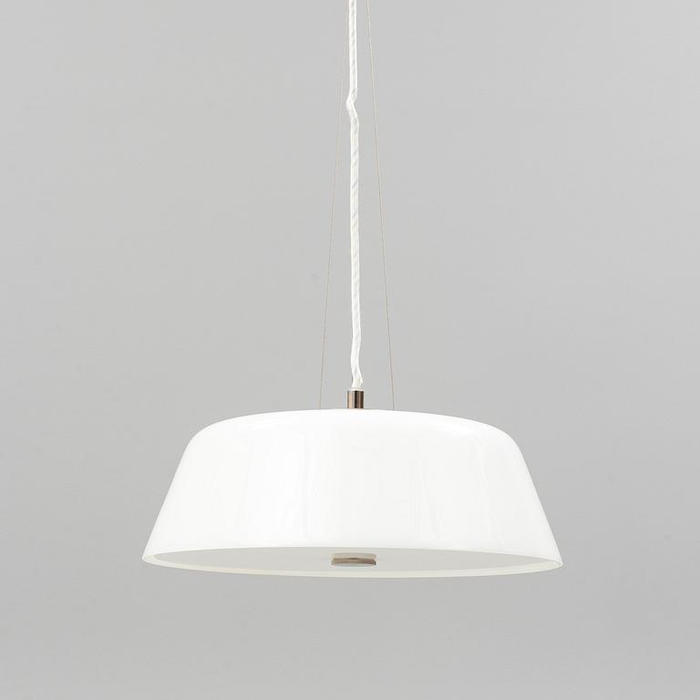 An Arne Jacobsen "Centenary Package" comprising three "Ant Chairs" and an eggshaped table, Fritz Hansen, Denmark.