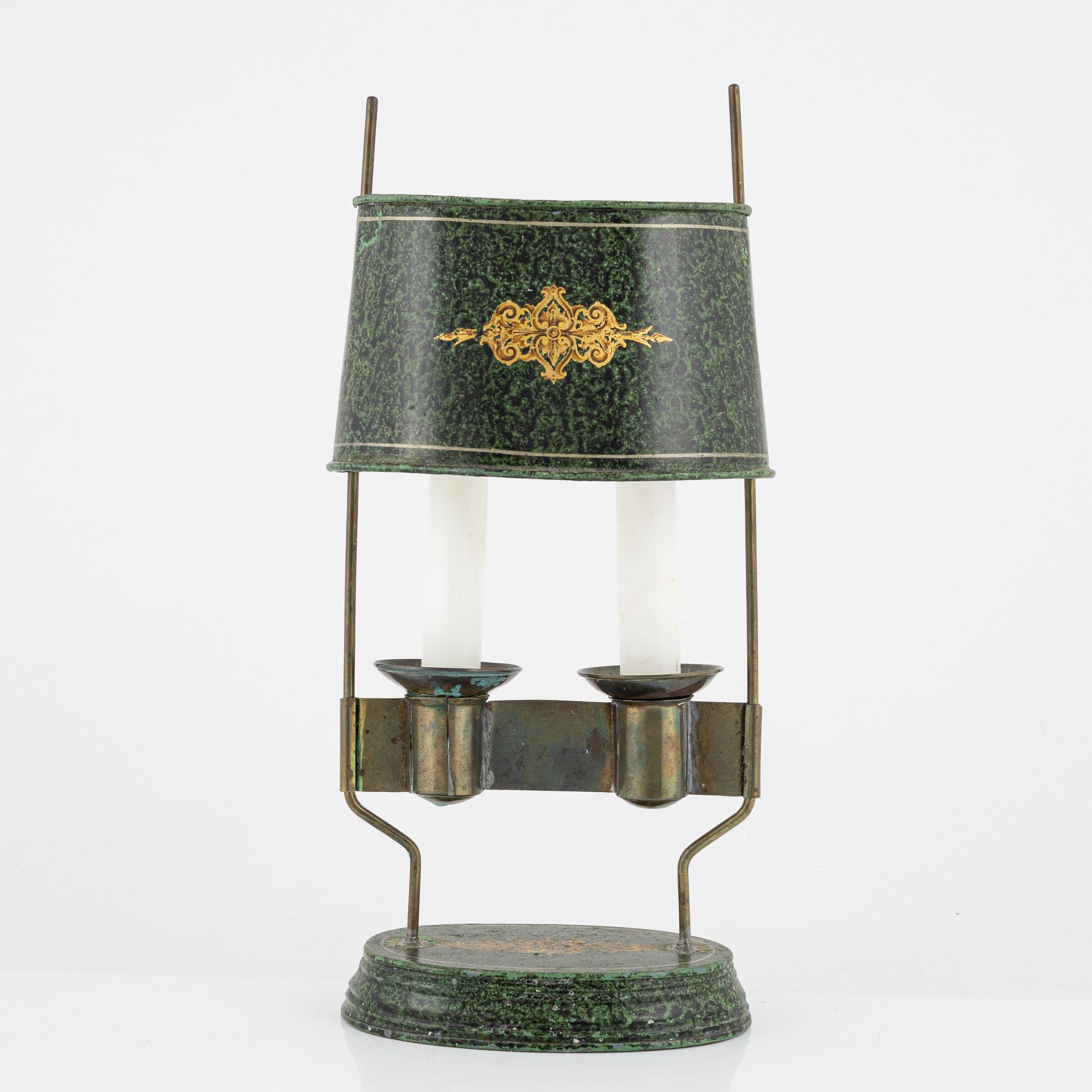 An empire style candlestick, circa 1900.