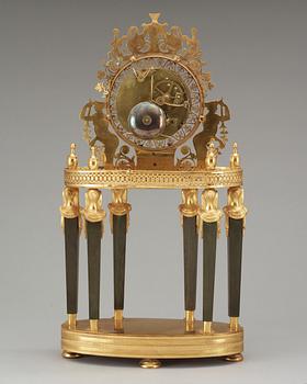 A French Empire gilt bronze mantel clock by L Grognot.