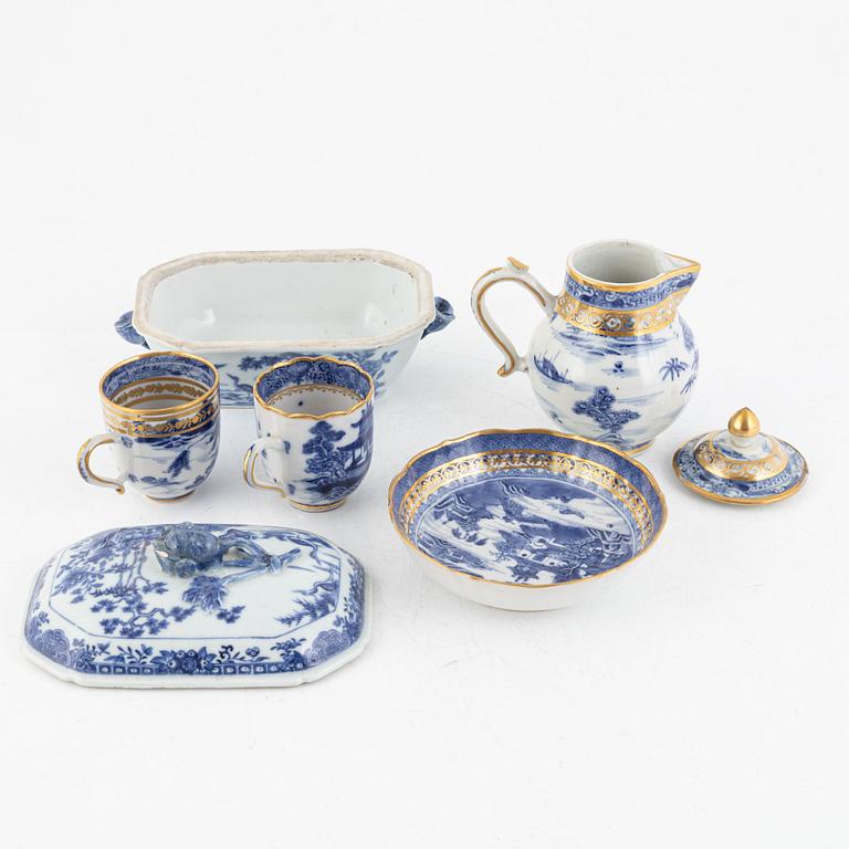 A small Chinese export tureen with cover, two cups, a saucer and a jug with cover, Qing dynasty, 18th century.