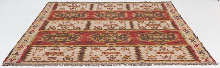 A Kilim carpet, c. 305 x 250 cm.