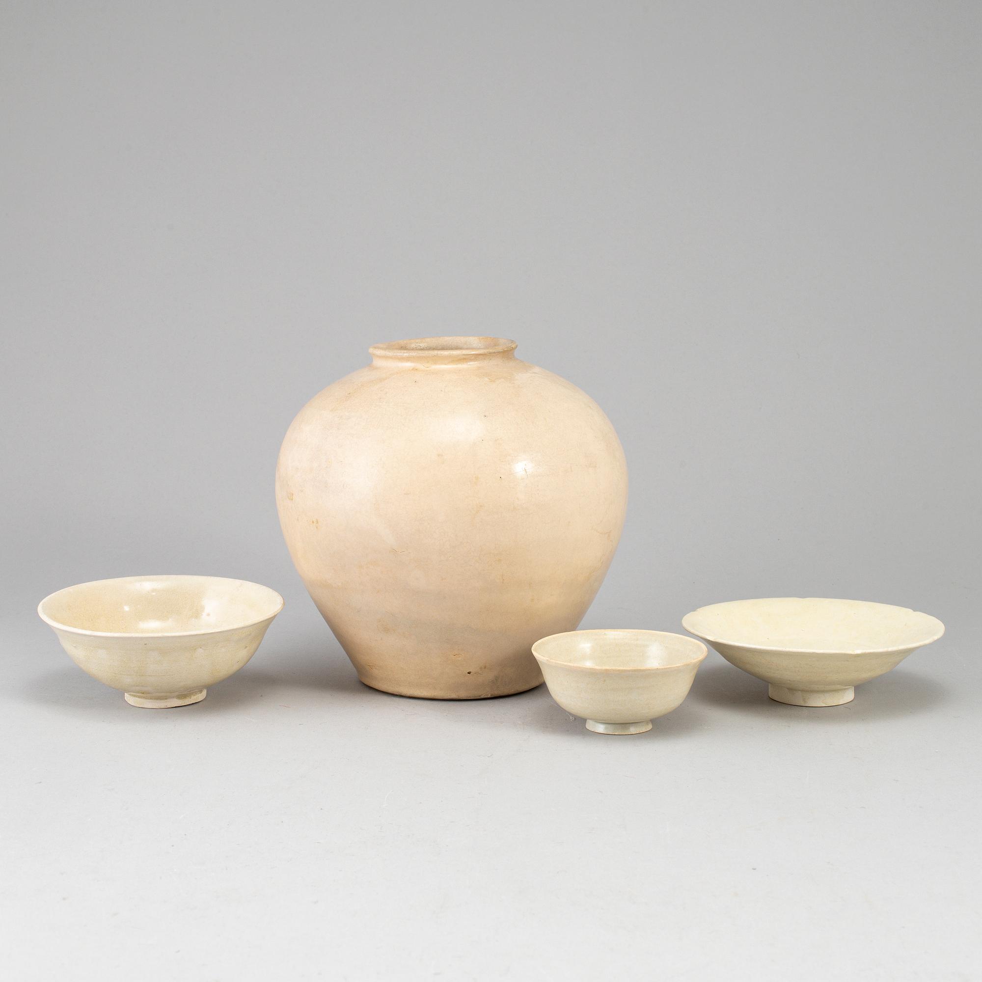A group of white glazed South East Asian Ceramics, 20th Century or earlier. (4 pieces).