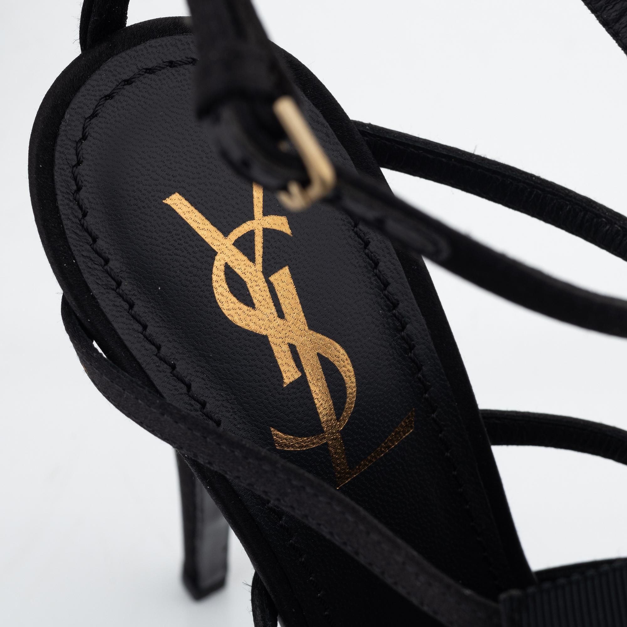 Yves Saint Laurent, a pair of black silk and bows platform sandals, size 37.