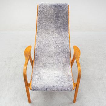 Yngve Ekström, a 'Lamino'  shearling upholstered lounge chair and foot stool from Swedese.