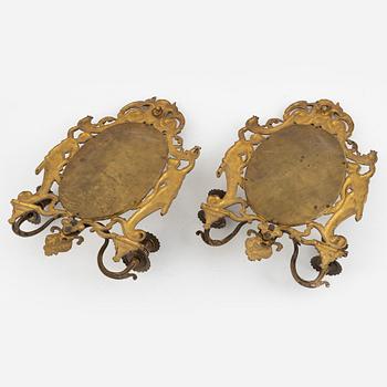 A pair of eclectic mirror sconces, first half of the 20th century.