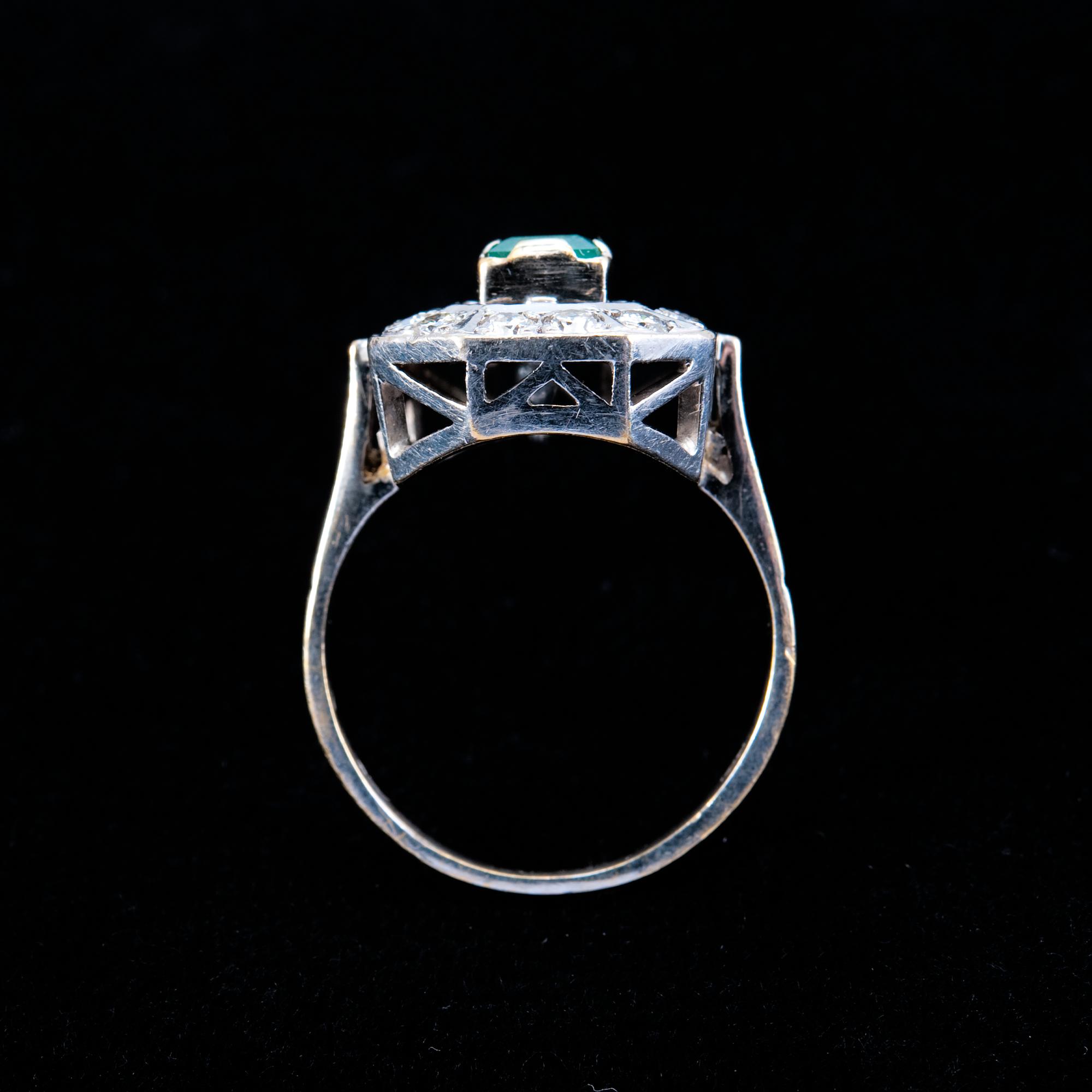 A RING, emerald c. 0.55 ct and diamonds c. 0.70 ct.