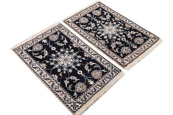 A pair of rugs, Nain, part silk, ca. 89 x 57 cm & ca. 90 x 60 cm.