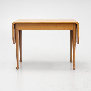 Josef Frank, a model 1007 mahogany drop leaf table, Svenskt Tenn, Sweden, second part of the 20th Century.