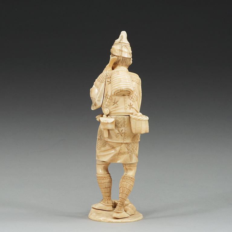 A Japanese ivory figure of a man, Meiji (1868-1912).