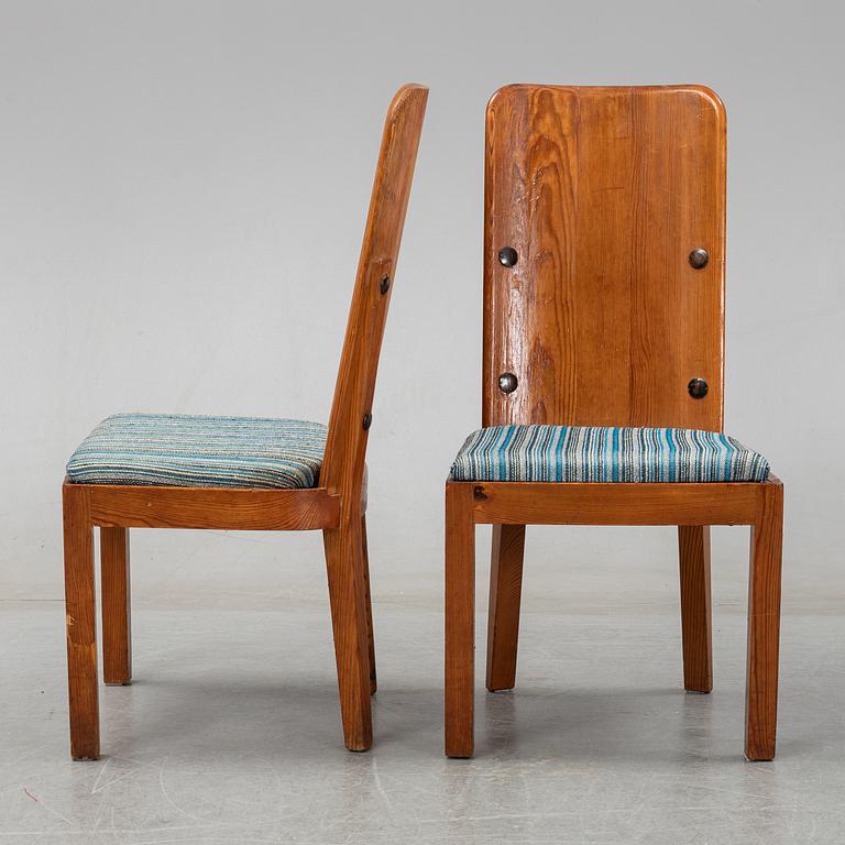 Axel Einar Hjorth, a pair of stained pine "Lovö" chairs, Nordiska Kompaniet, Sweden 1930's.