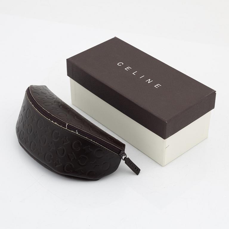 Céline, a pair of black and silver-color sunglasses.