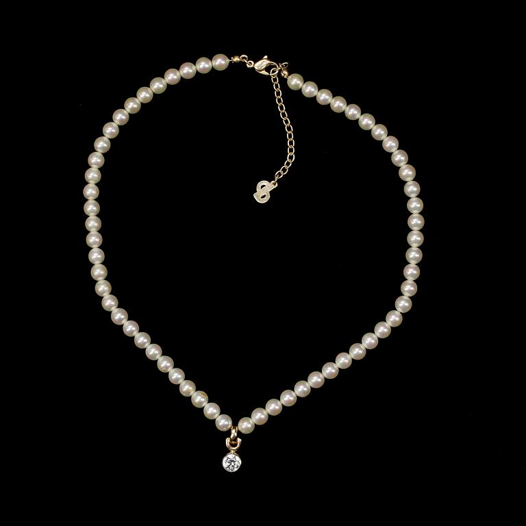 A necklace with decorative pearls by Christian Dior.