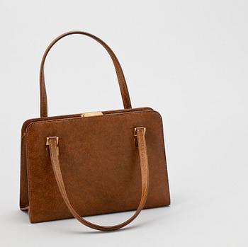 1389. A 1960s/70s brown leather handbag by Gucci.