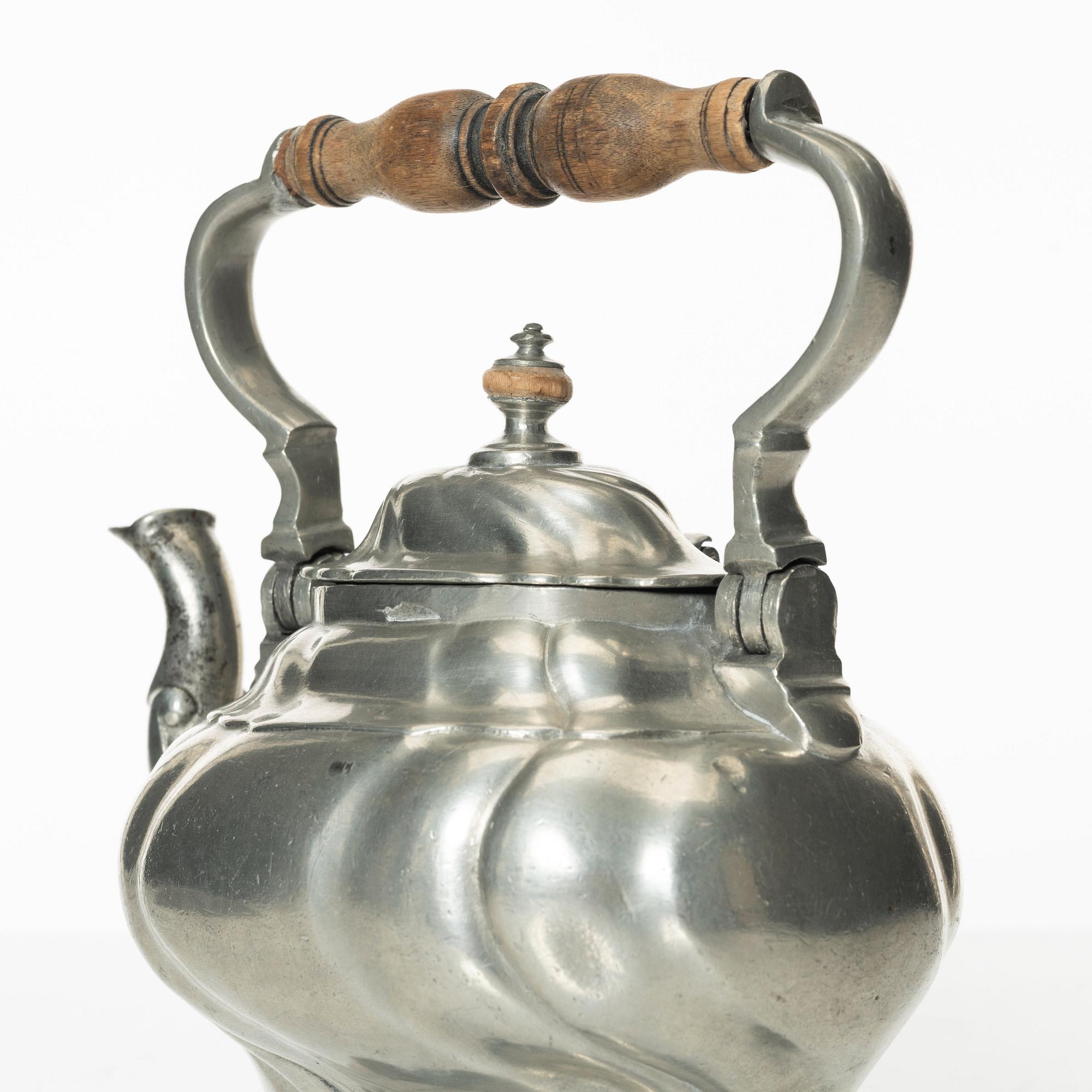A Rococo pewter teapotby P J Mattsson 1808.