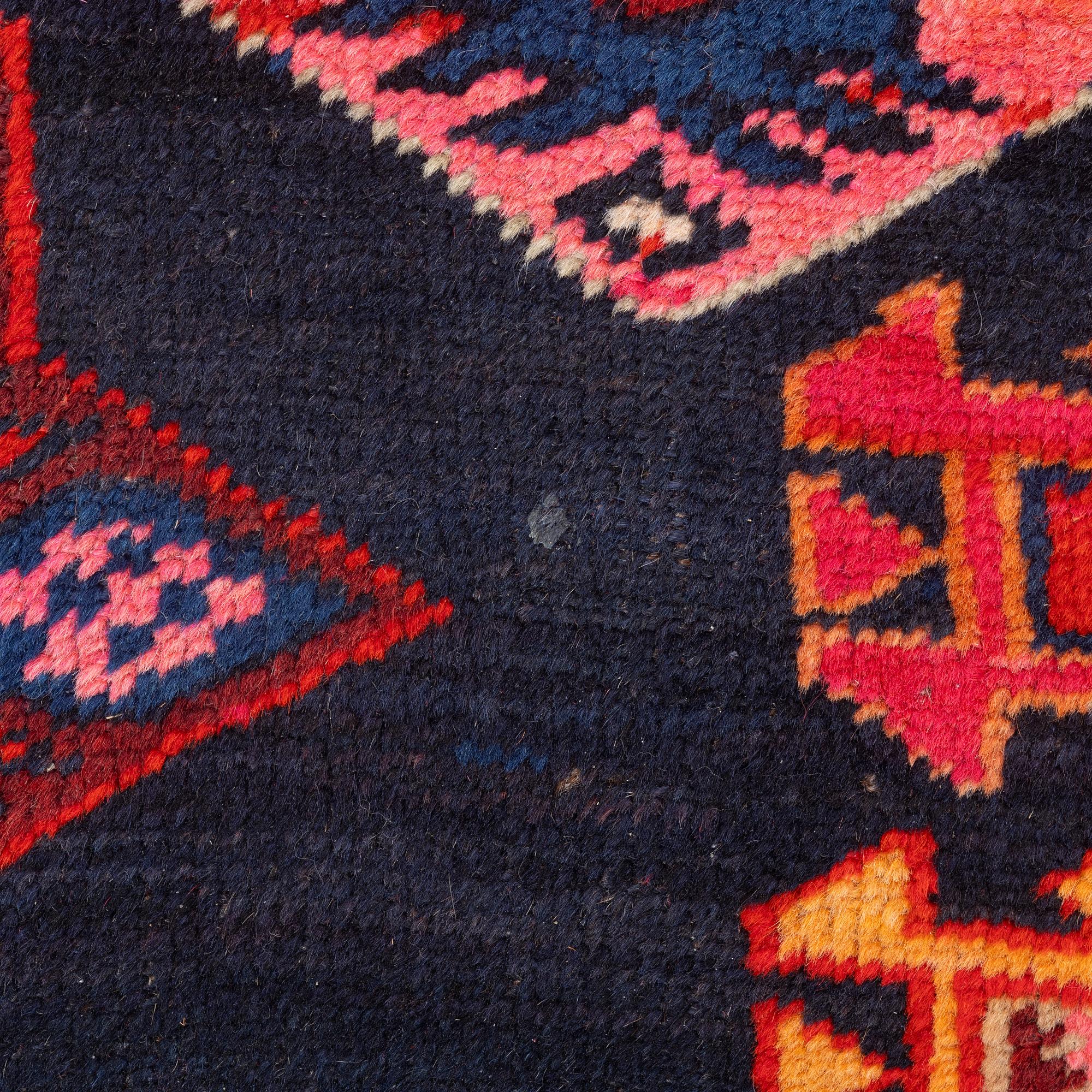 A semi-antique Anatolian runner, c. 409 x 159 cm.
