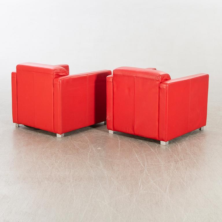 A pair of Italian 1990's leather armchairs.