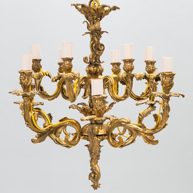 A late 19th-century 12-arm bronze chandelier.