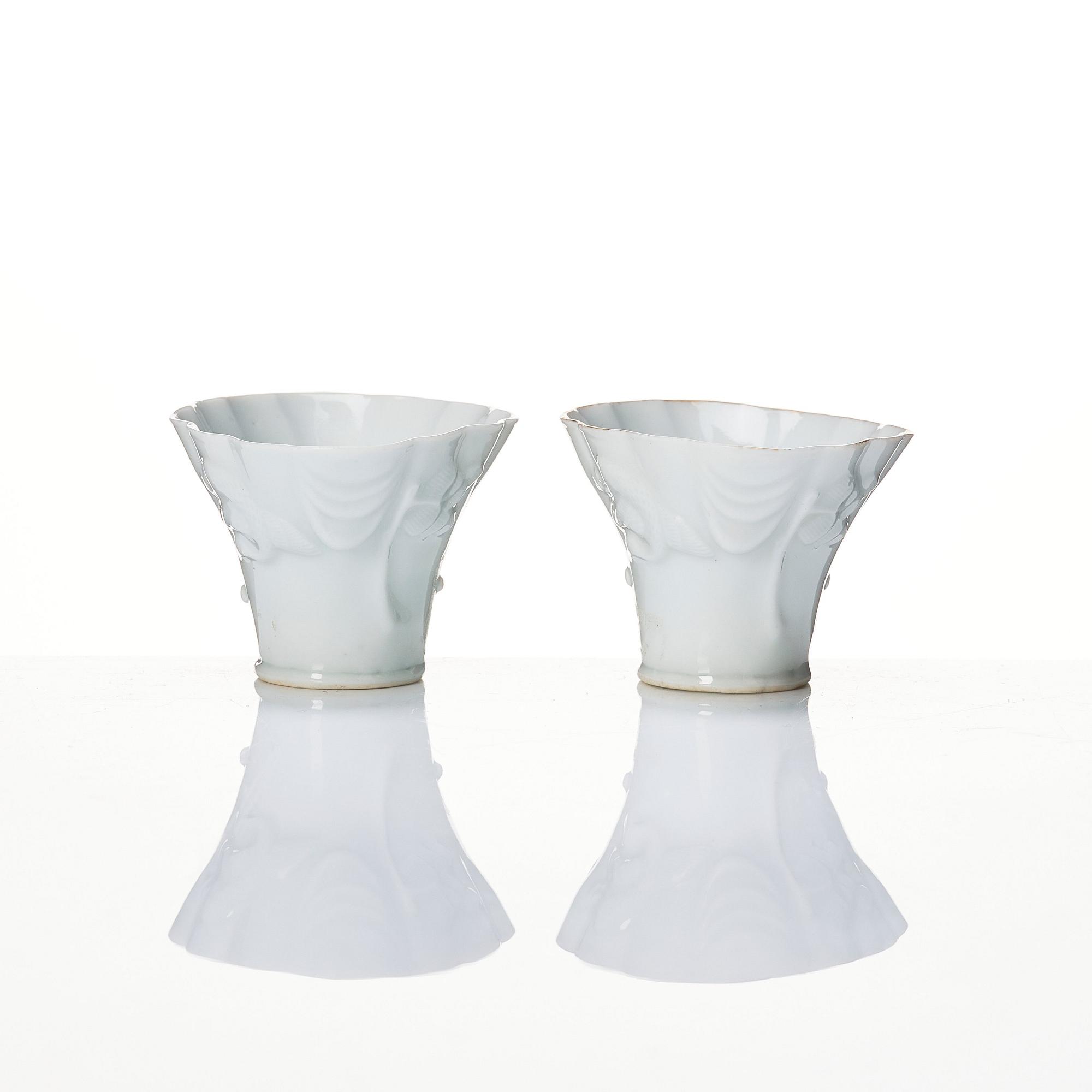 A pair of blanc de chine libation cups, Qing dynasty, 19th Century.