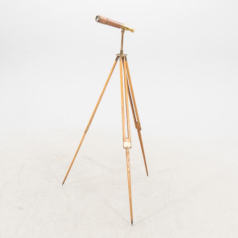 A brass and leahter tube binocular with stand around 1900.