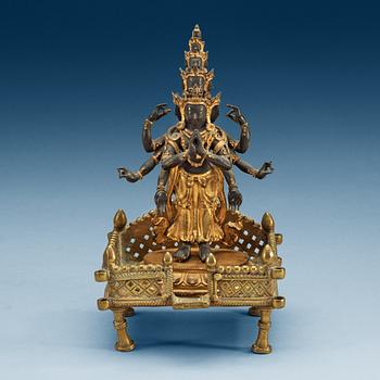 1859. A gilt bronze figure of eleven-faced Avalokiteshvara, Tibet/Nepal, 19th Century.