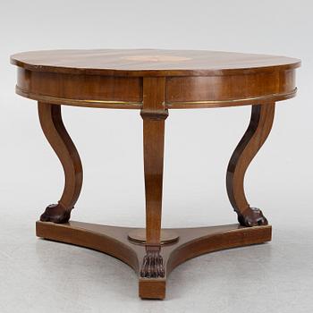 A mahogany veneered Empire style table, first half the 20th Century.