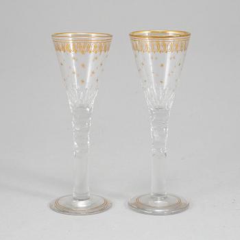 A set of 17 cut and gilded glasses, 20th Century.