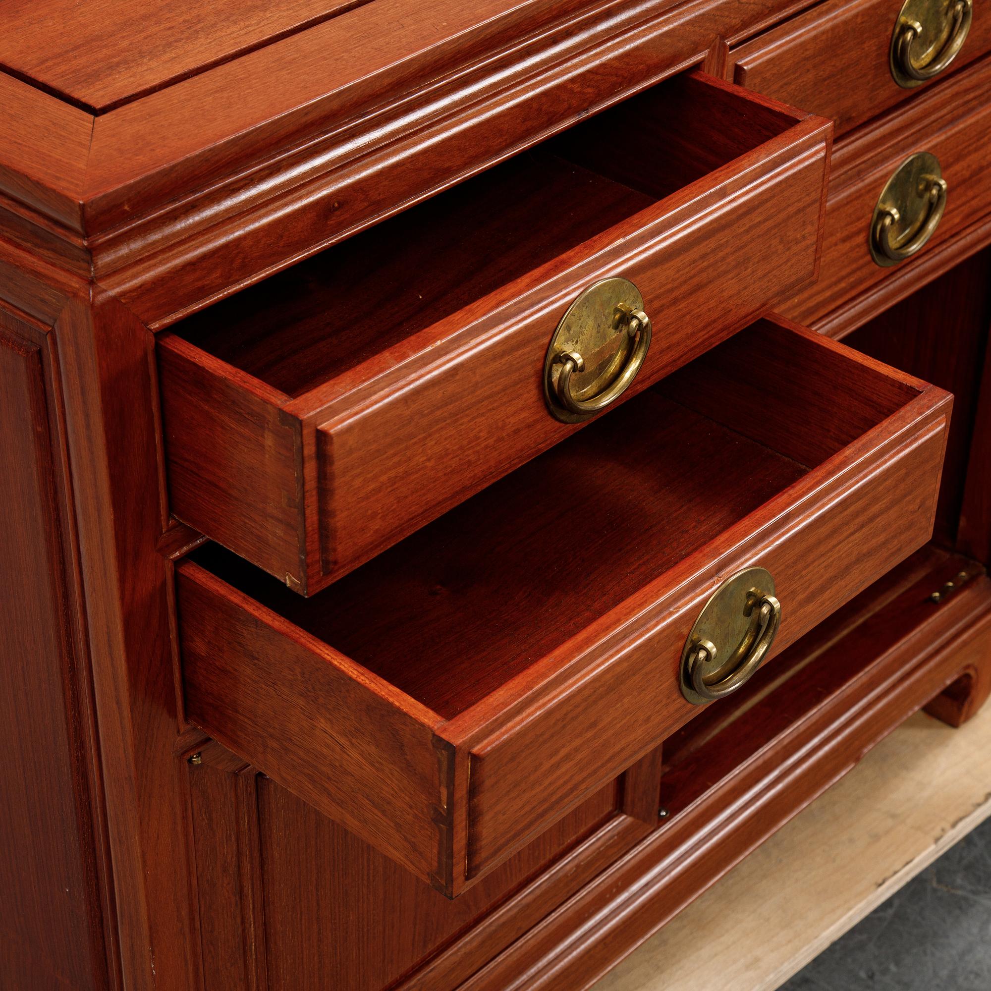 A pair of cupboards or sideboards, Yuen Cheong Furniture Co, Hong Kong, second half of the 20th century.