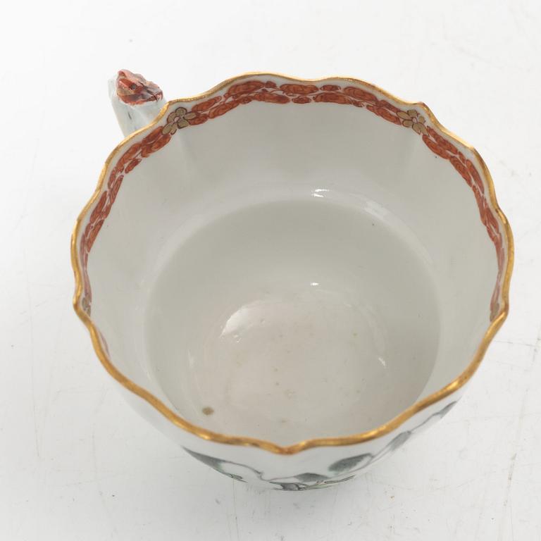 A pair of Chinese famille rose teacups with saucers and a pair of plates and two dishes, Qing dynasty, 18th century.