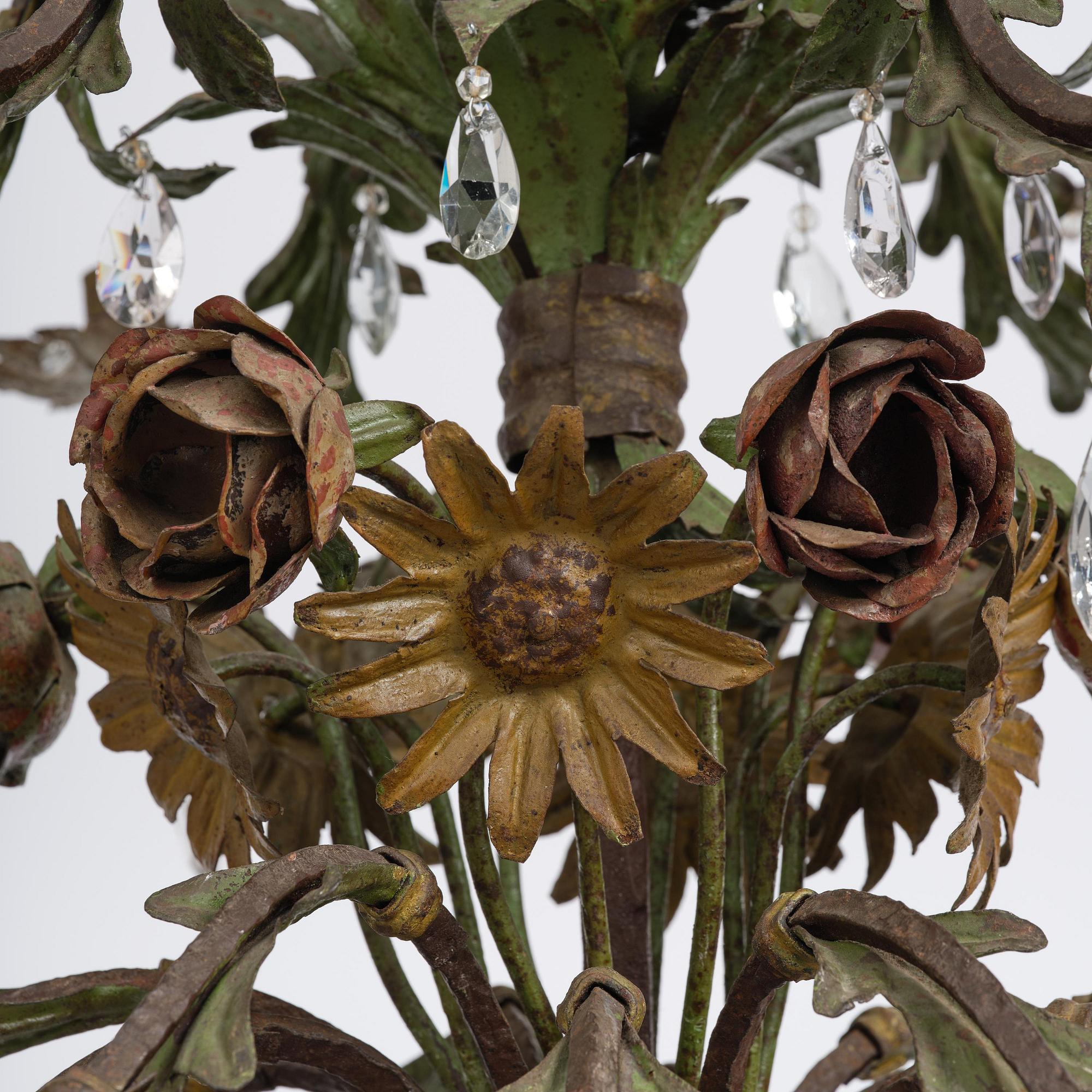A North-Italian iron and tole-peinte eighteen-branch chandelier, 19th century.