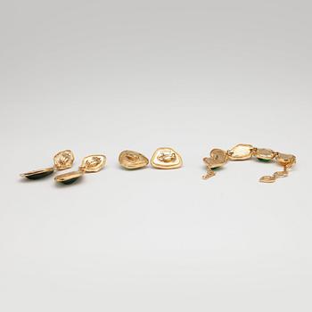 YVES SAINT LAURENT, a gold colored bracelet with glass stones  and two pairs of earclips.