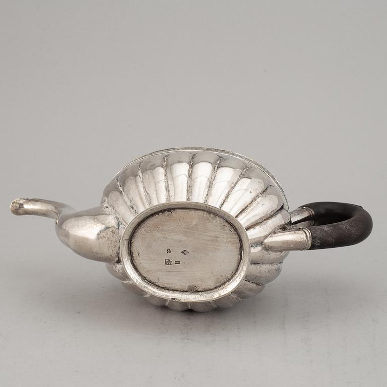 A Russian 19th century parcel-gilt silver tea-pot, marked Moscow 1833.