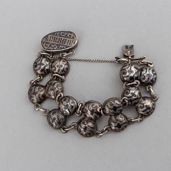 A Russian silver and niello bracelet and two belt buckles, unidentified makers mark, Kiev 1896-1908 and other.