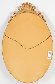 An oval Gustavian style mirror, early 20th Century.