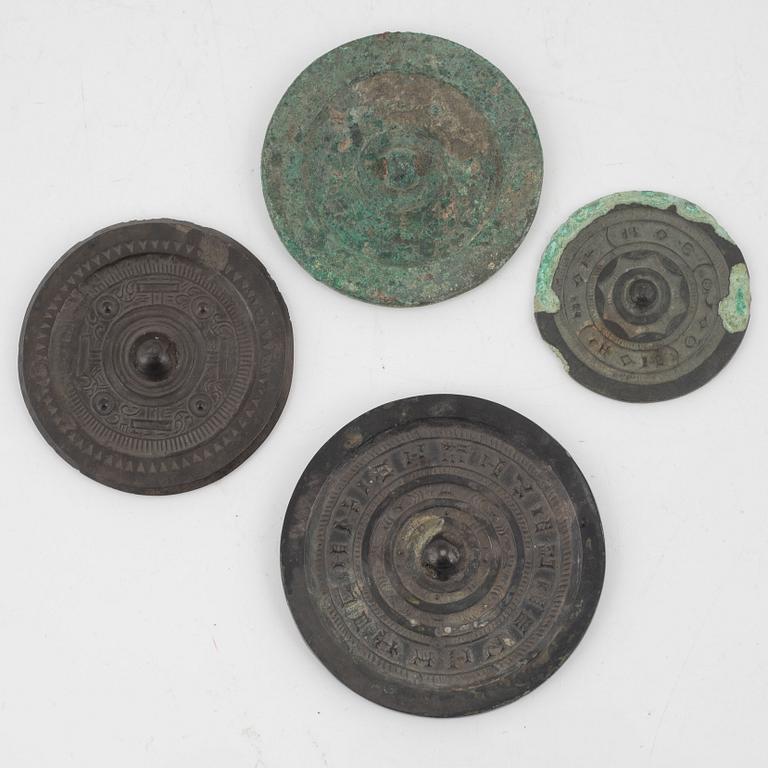 Four bronze lobed mirrors,  Han dynasty (206 B.C.-220 A.D.).