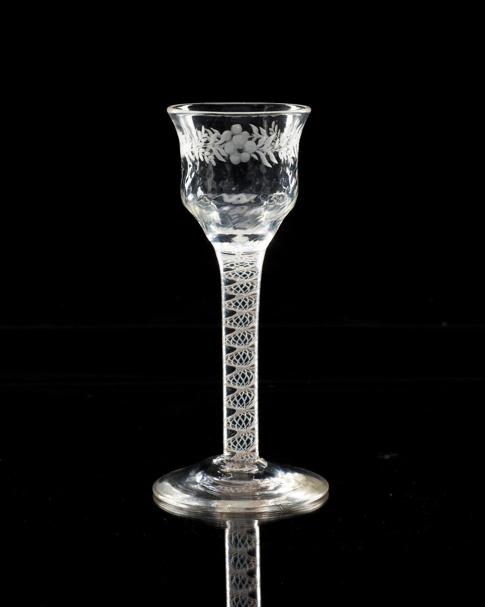 An engraved wine glass, 18th Century, presumably English.