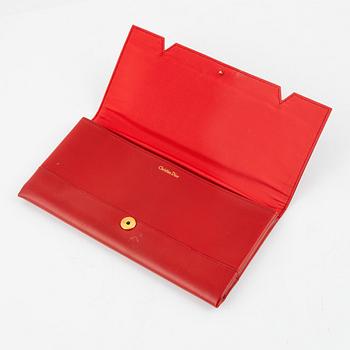 Christian Dior, a red box calf leather clutch.