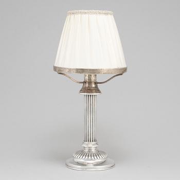 An English 19th century silver candlestick and shade, mark of London 1890.