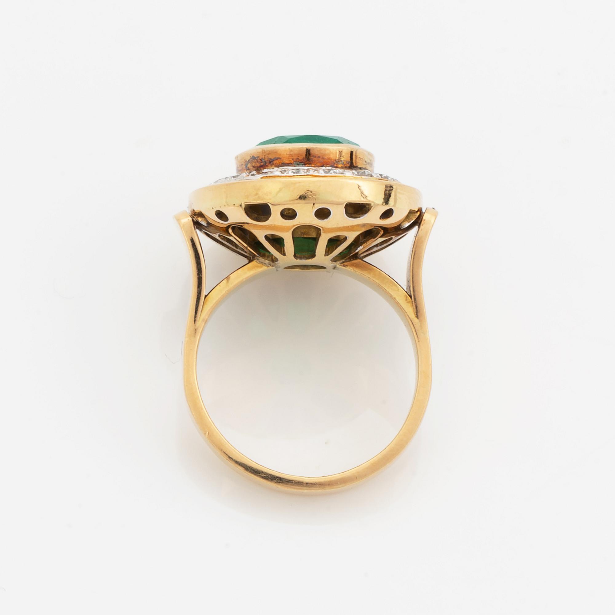 Emerald and brilliant-cut diamond ring.