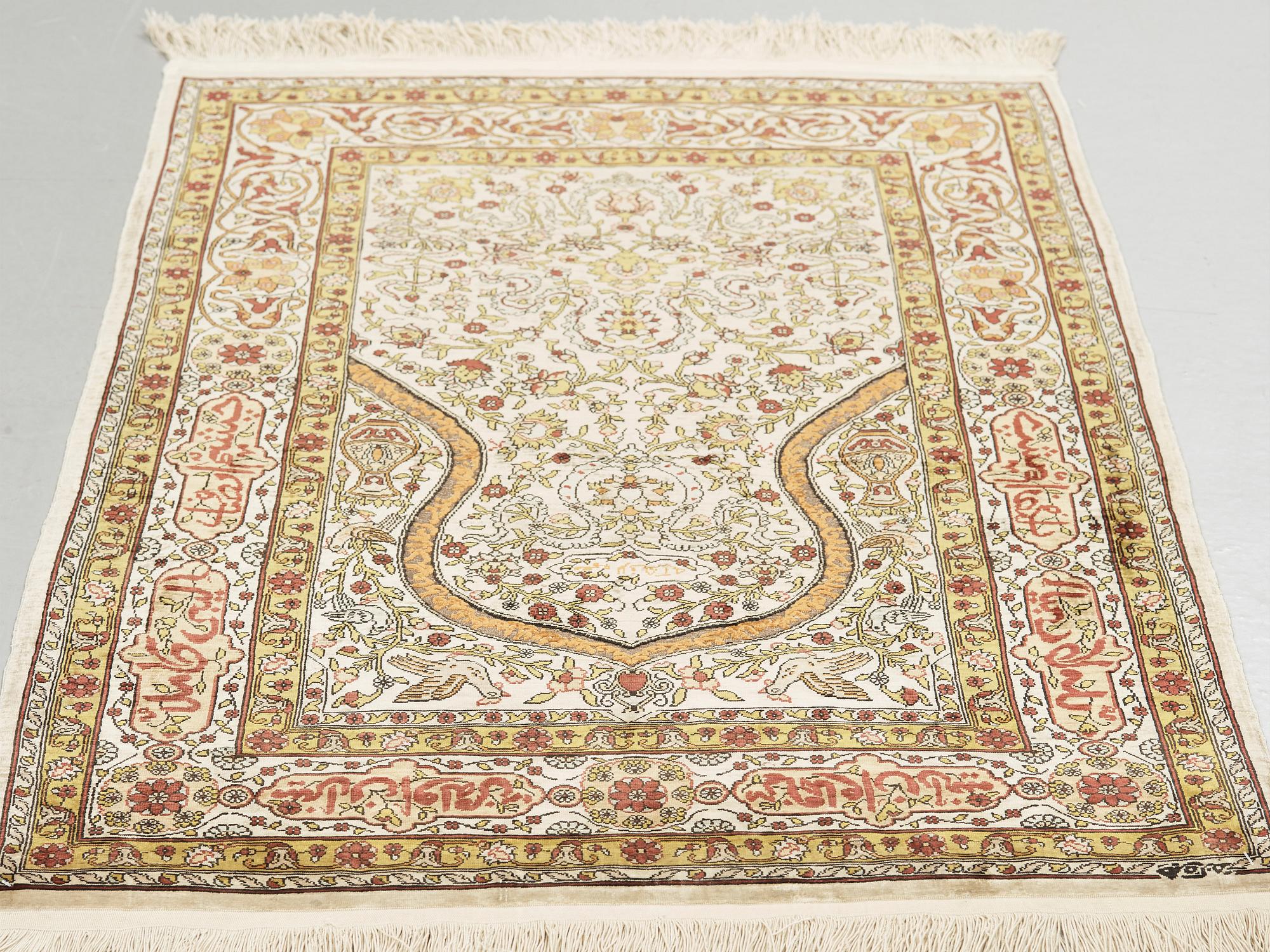 A silk Hereke possibly, around 96 x 66 cm.