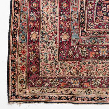 An antique Kerman Laver carpet, c. 586 x 385 cm.