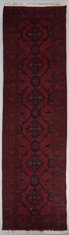 An Afghan runner, ca. 295 x 82 cm.